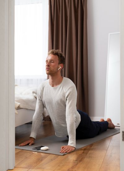 man stretching on a mat